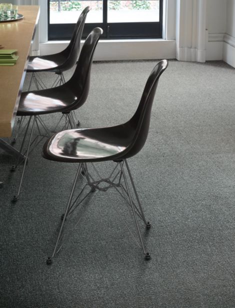 Interface UR302 carpet tile in close up with chairs