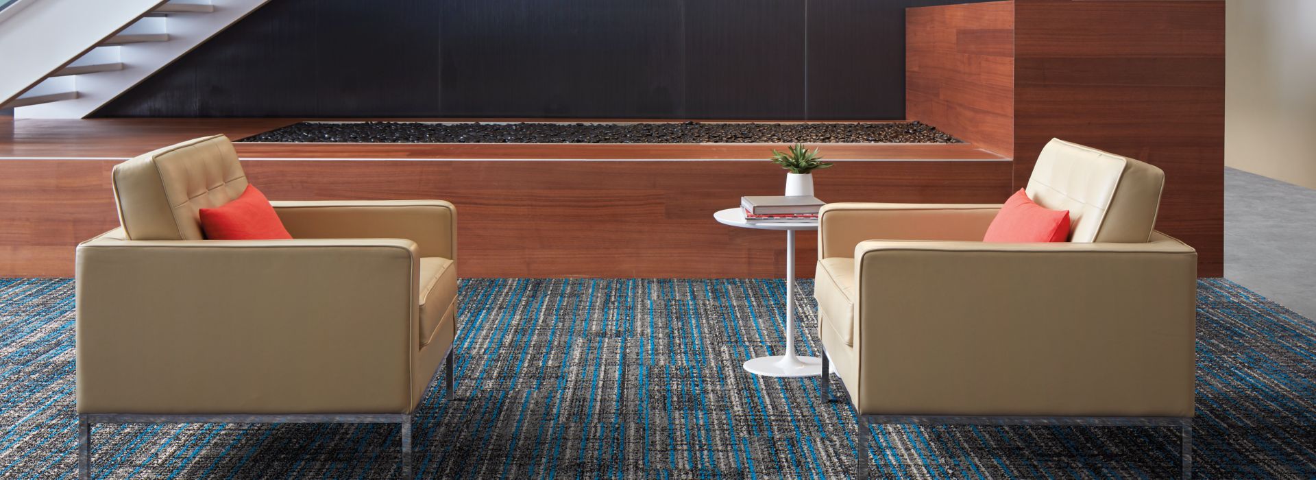 Interface Upload carpet tile and Textured Stones LVT in lobby area with couches