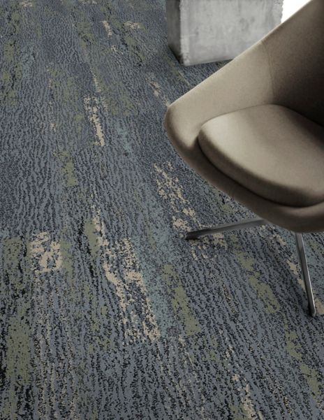 Detail of Interface Uprooted plank carpet tile with chair