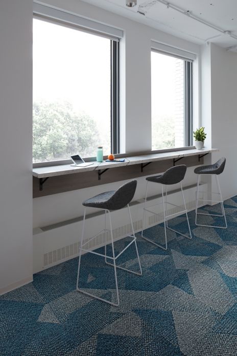 Interface Upward Bound carpet tile in bar area with stools and window