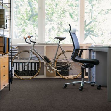 Interface Vector carpet tile in office area with bike