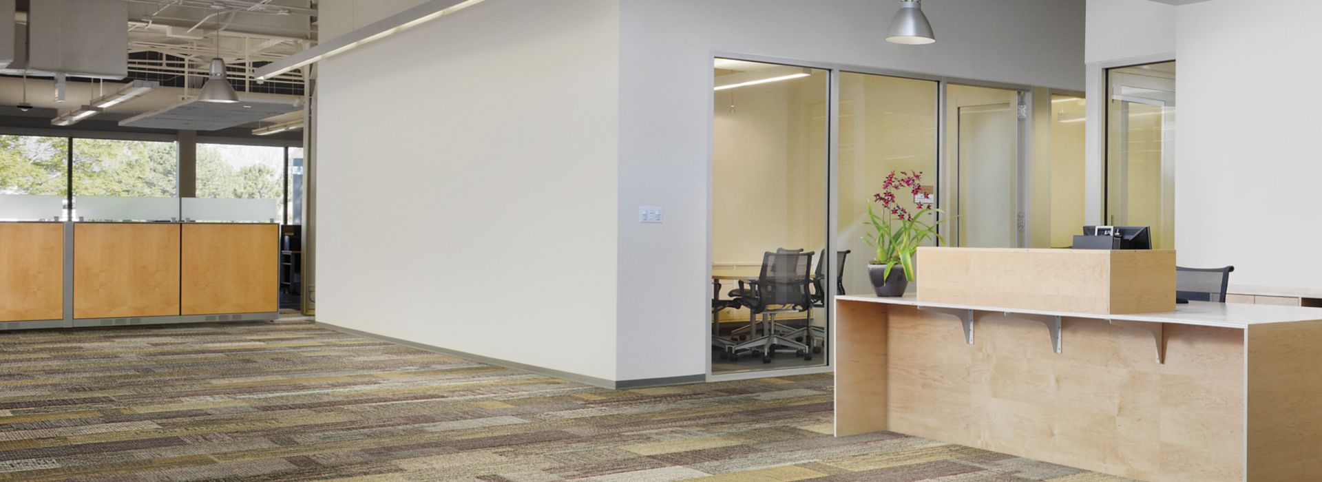 Interface Verticals plank carpet tile in open office setting with reception desk