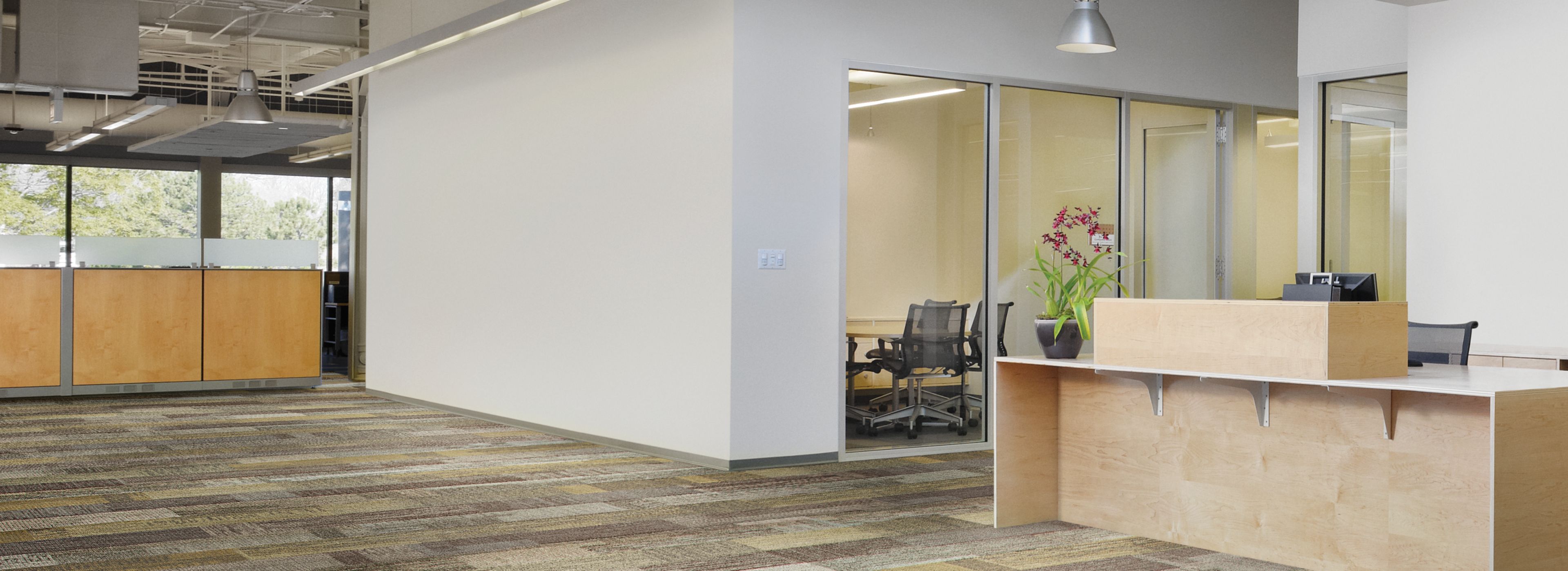 Interface Verticals plank carpet tile in open office setting with reception desk image number 1