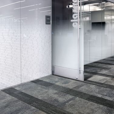Interface Exposed and Verticals carpet tiles outside of frosted glass office at Meridian imagen número 1