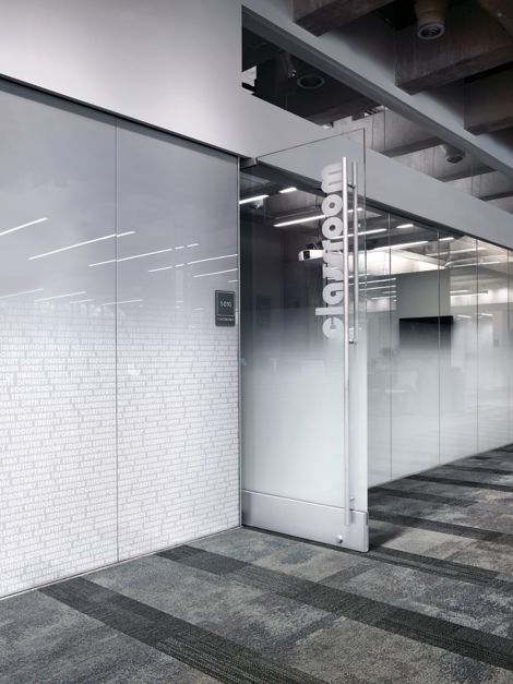 Interface Exposed and Verticals carpet tiles outside of frosted glass office at Meridian