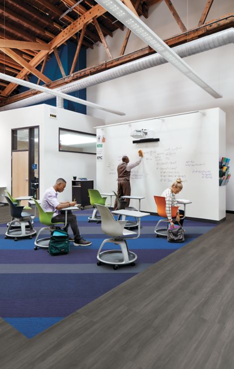 Interface Viva Colores carpet tile and Studio Set LVT in class room setting with white board
