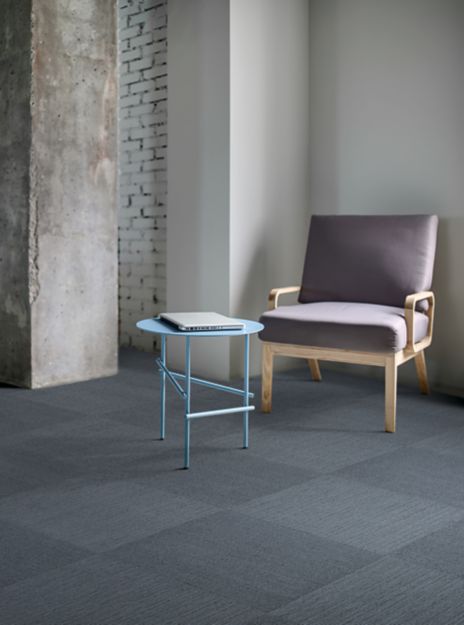 Interface Viva Colores carpet tile in seating area with single chair