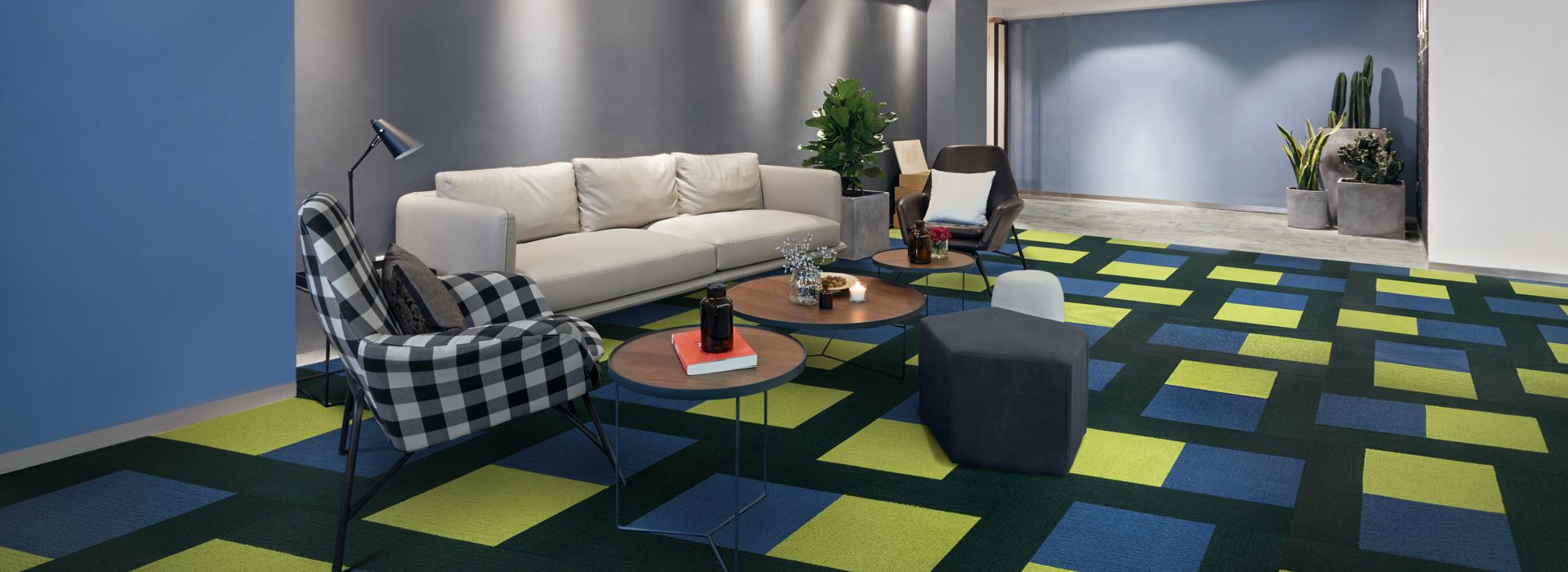Interface Viva Colores carpet tile and Textured Stones LVT in seating area with couch 