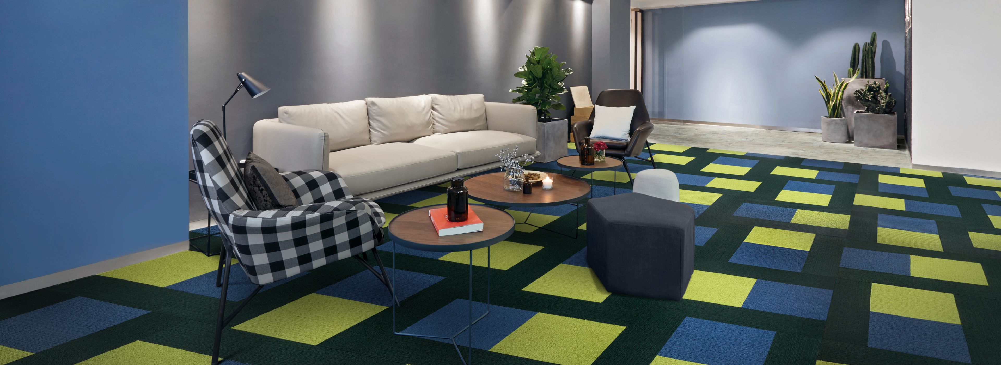 Interface Viva Colores carpet tile and Textured Stones LVT in seating area with couch  image number 1