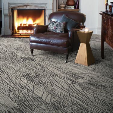 Interface WE152 plank carpet tile in sitting area with fireplace and large leather chair image number 2