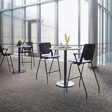 Interface WE153 plank carpet tile in meeting area with high top tables