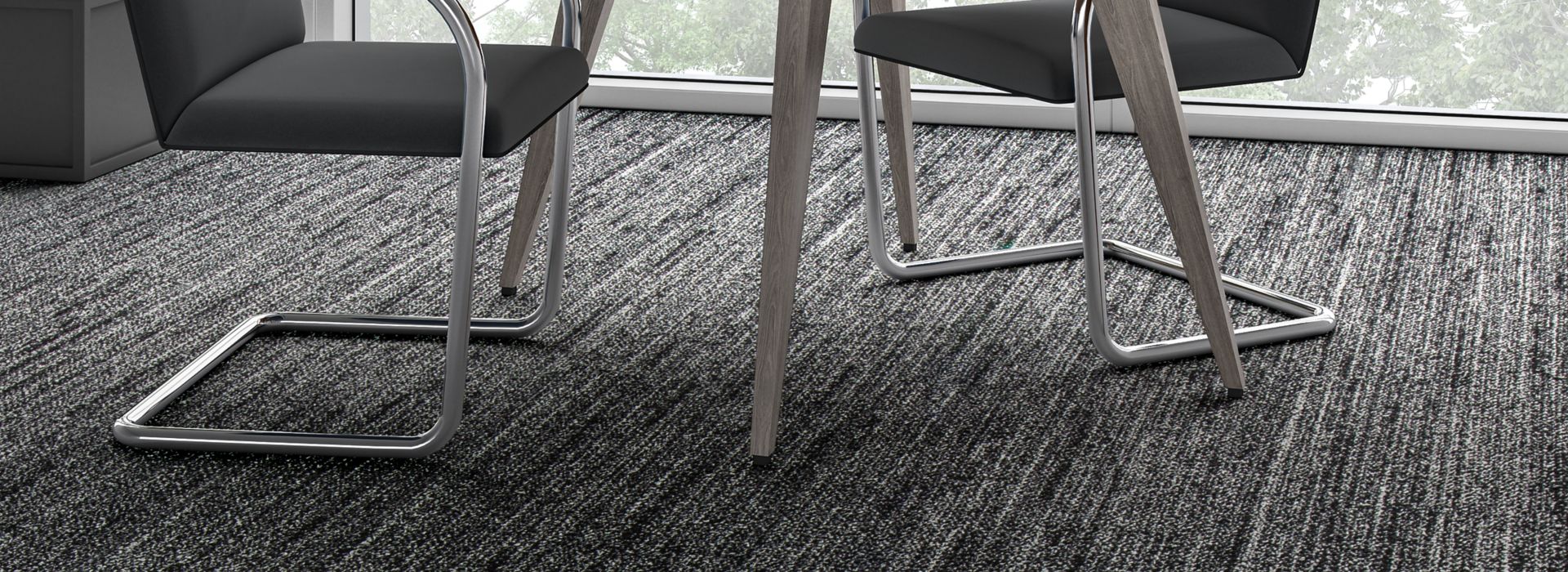 Interface WW870 plank carpet tile shown with small table and chairs