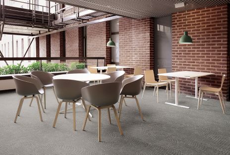 Interface Walk About LVT in building common area with table and chairs