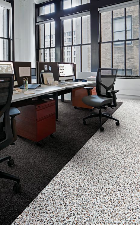 Interface Walk on By LVT and Step in Time carpet tile in cubicle area with rolling chairs
