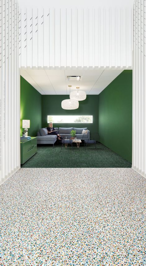 Interface Walk on By LVT and Step it Up carpet tile in office common space with couch and chairs 