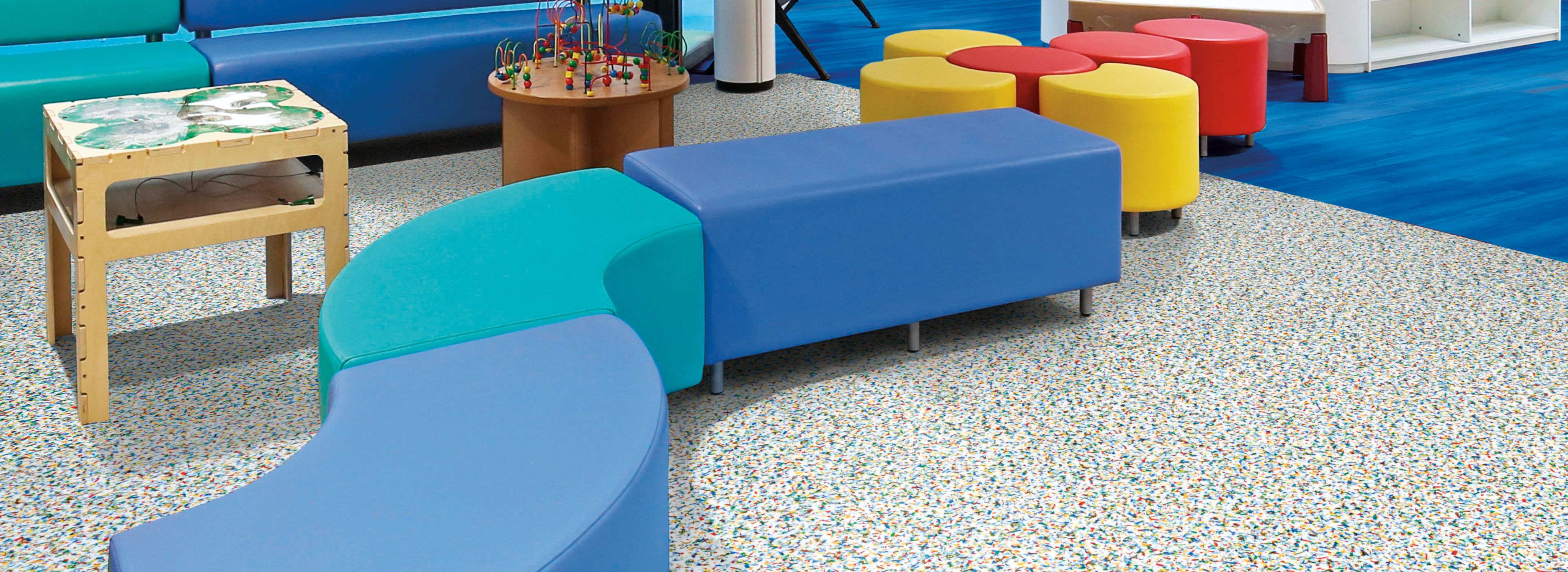 Interface Walk on By and Studio Set LVT in children's waiting area with colorful furniture image number 1