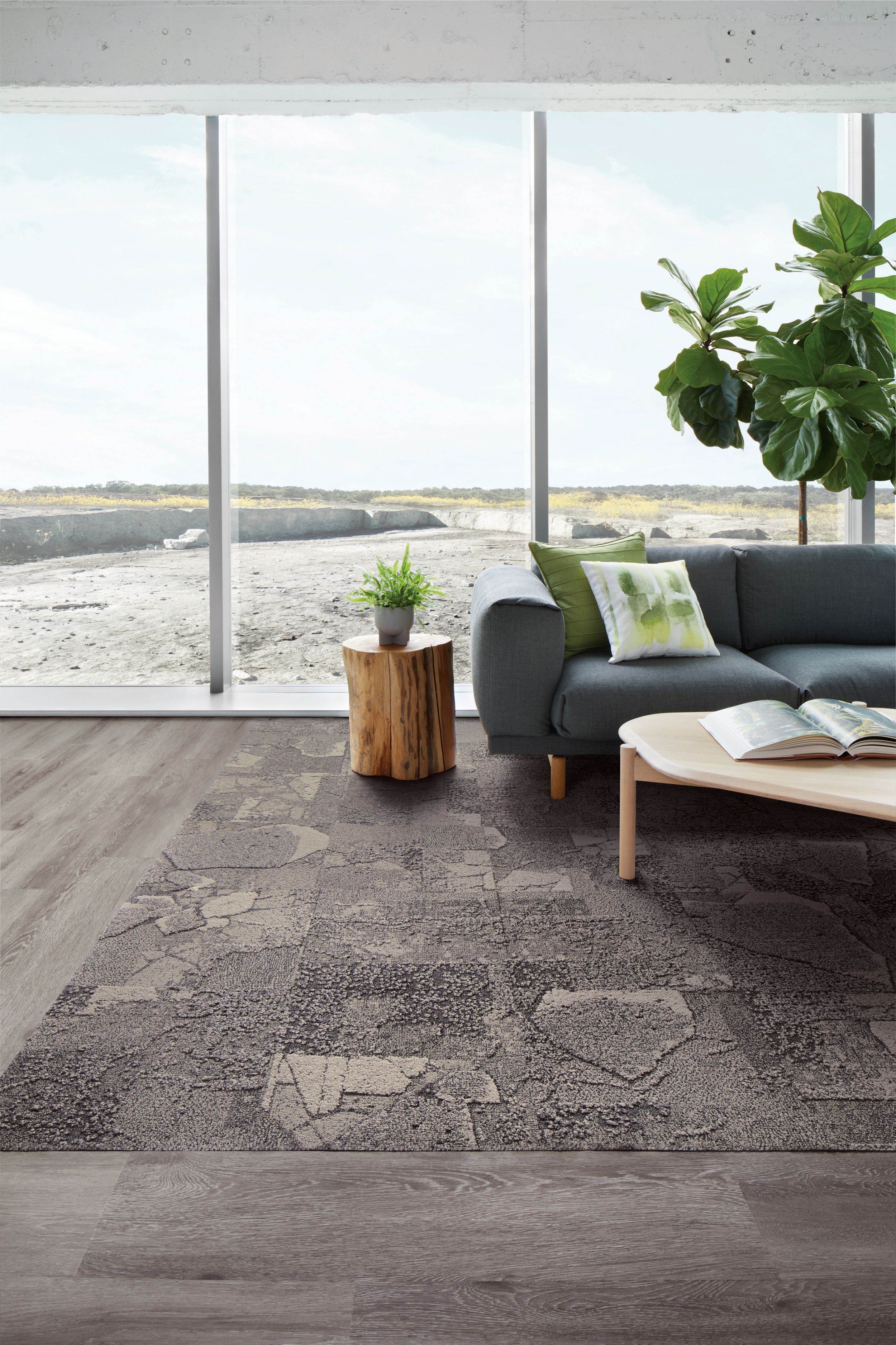 Interface Mountain Rock carpet tile and Textured Woodgrains LVT in seating area with plant on side table and behind couch image number 10