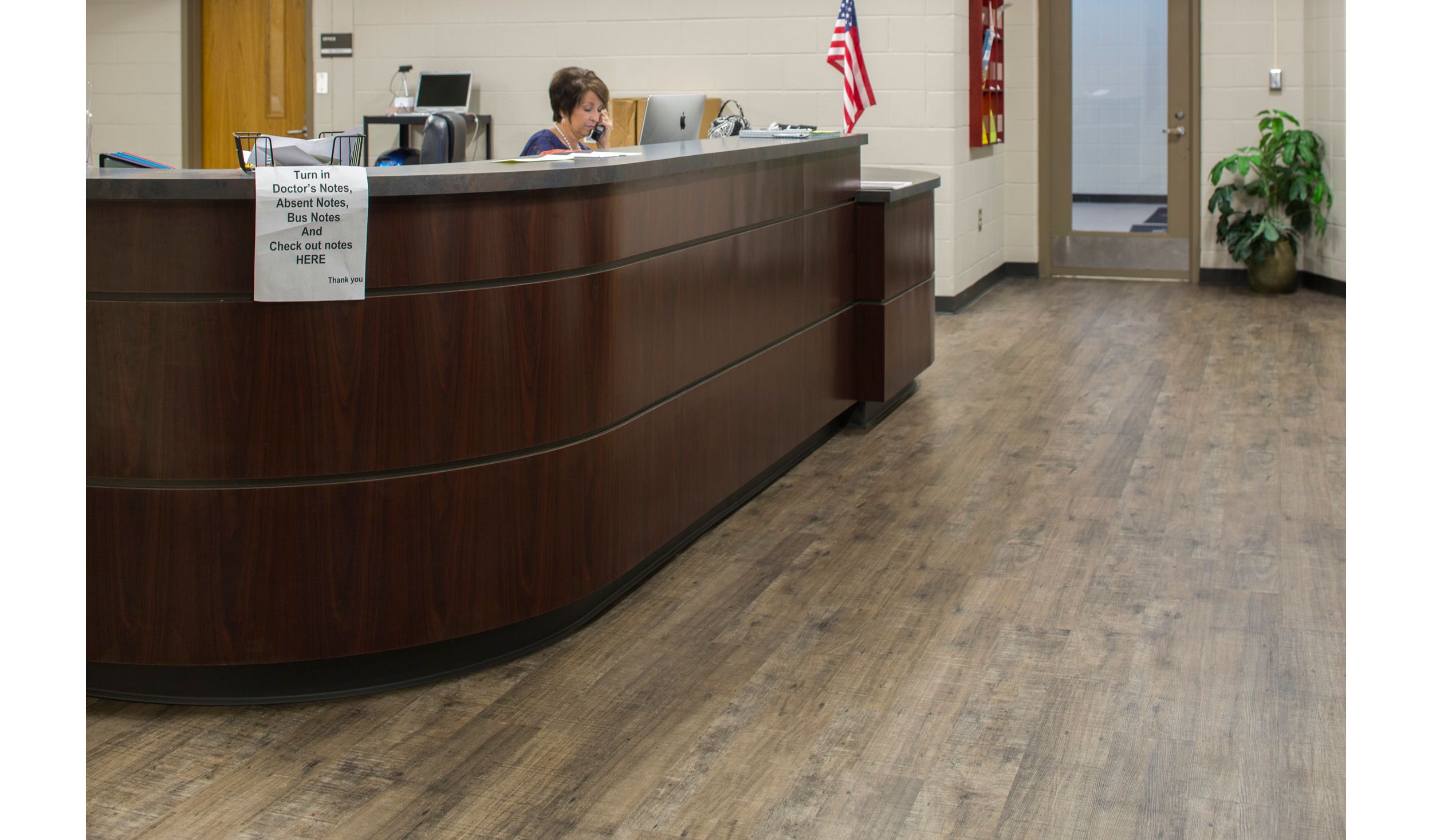 Interface Textured Woodgrains plank LVT in reception setting  image number 5
