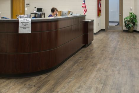 Interface Textured Woodgrains plank LVT in reception setting  image number 5