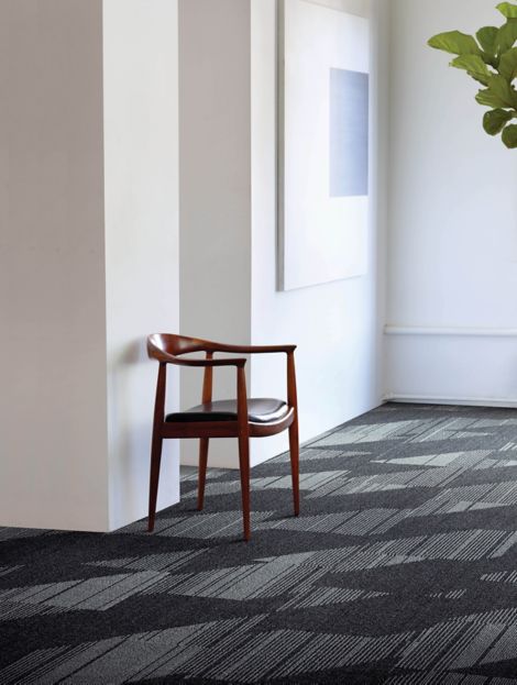 Interface Detours carpet tile in corridor with chair