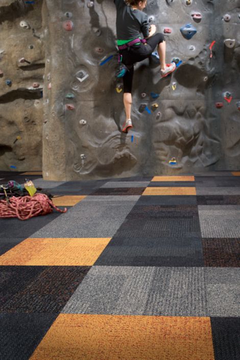 Interface Cubic and Cubic Colours carpet tile with climbing wall in background
