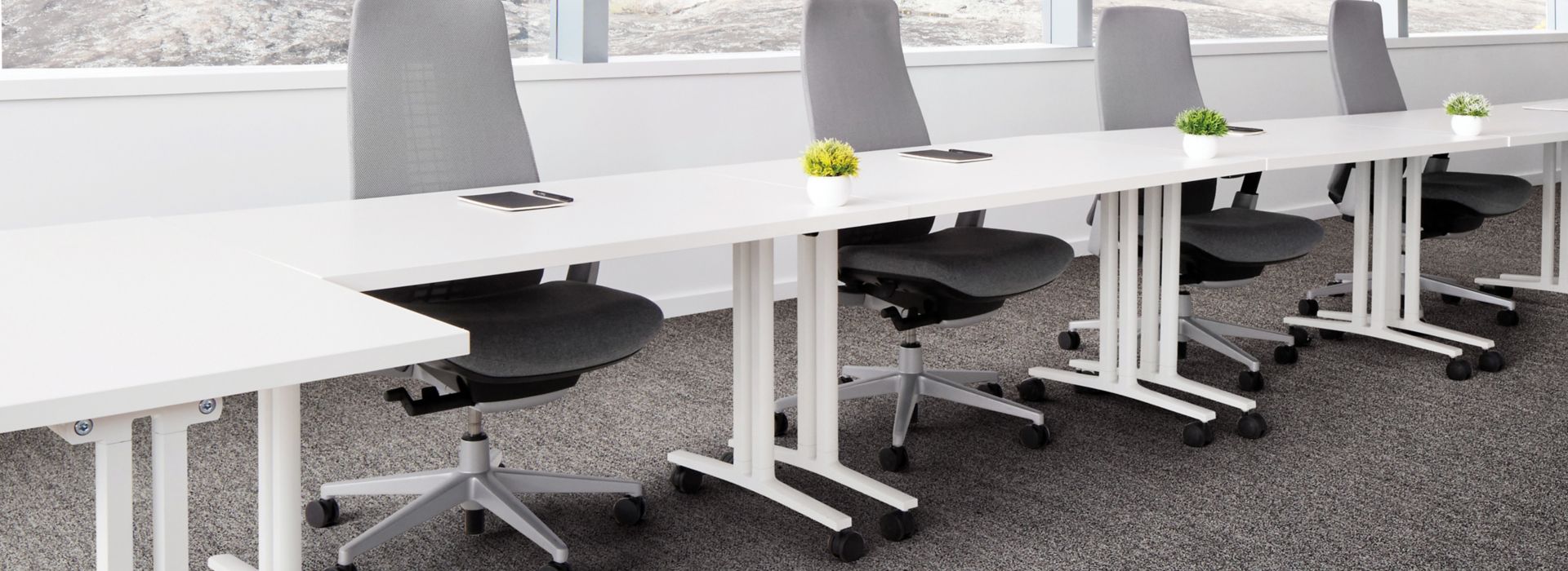 Interface Mantle Rock plank carpet tile in meeting room with white table