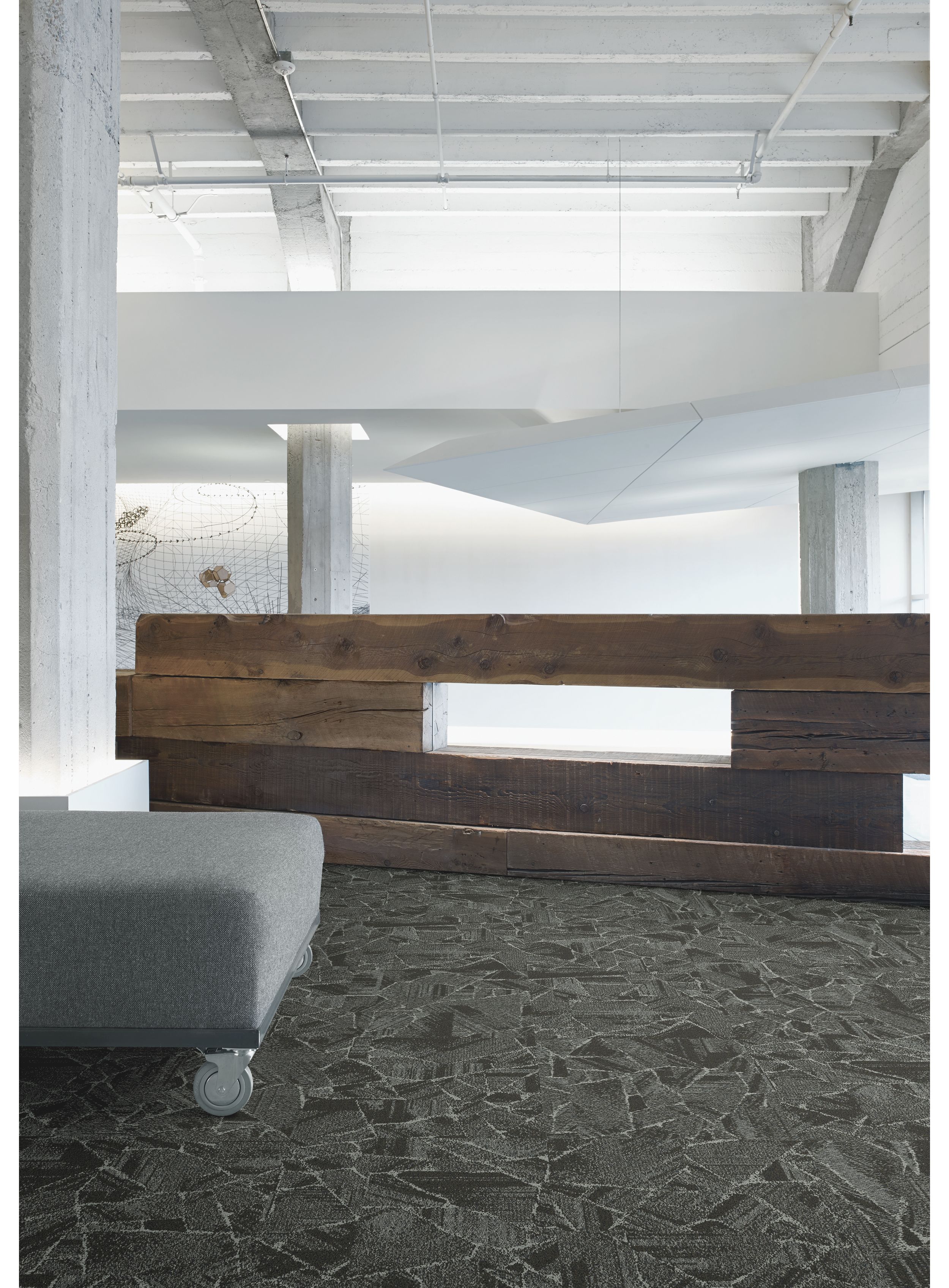 Interface Mile Rock carpet tile in room with wooden art structure and white walls image number 4