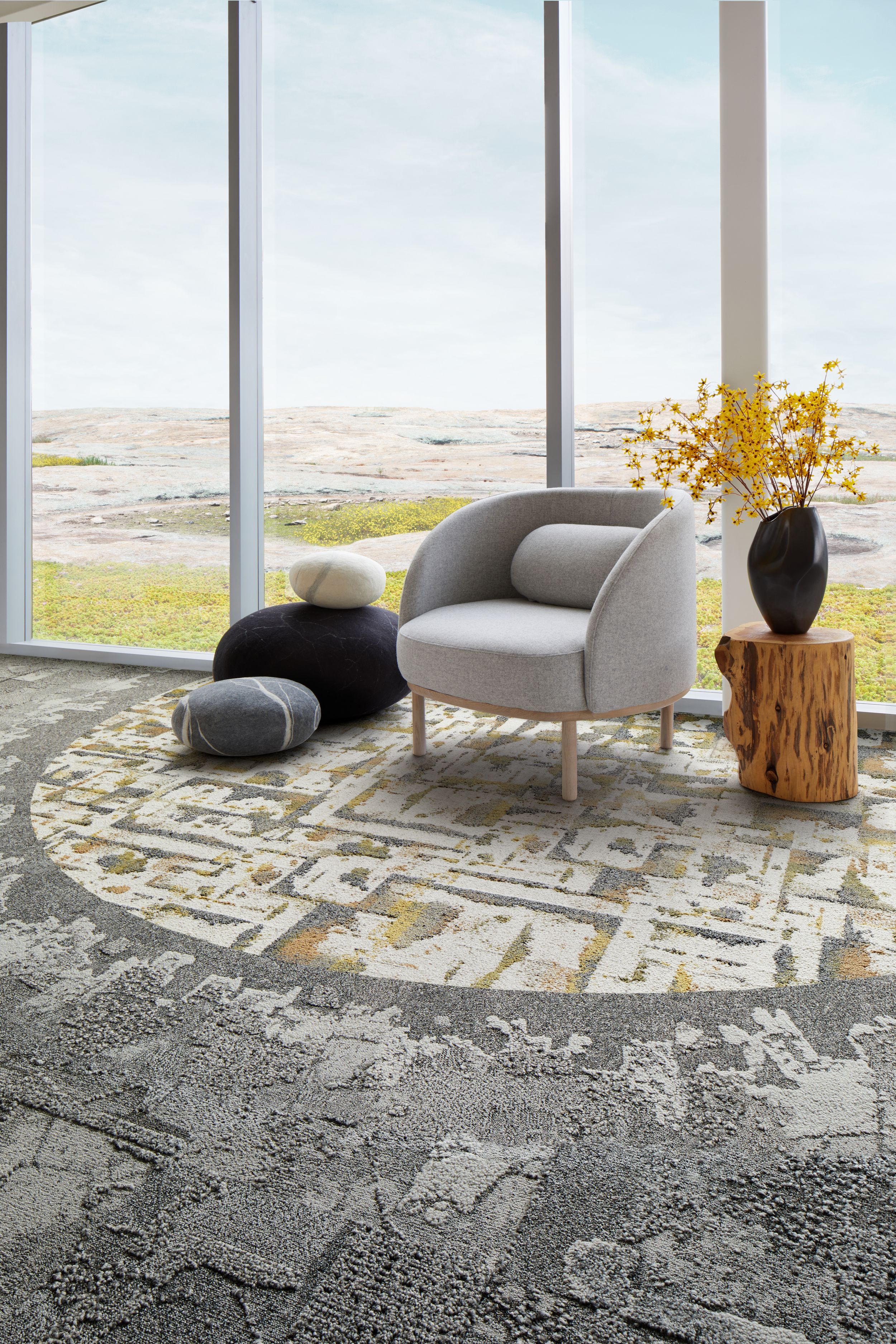 Interface Bridge Creek, Mountain Rock and Panola Mountain carpet tile in seating area with taupe chair and wood side table image number 7
