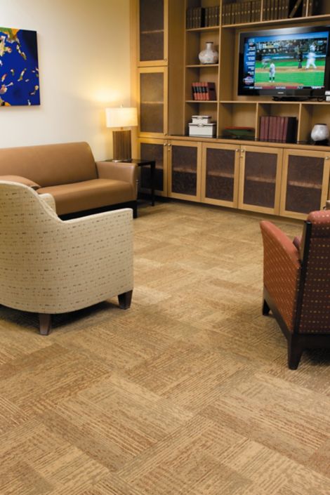 Interface Plain Weave carpet tile in living room area with couch and two chairs