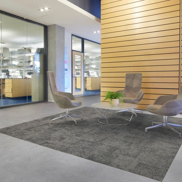 Interface carpet tile and LVT in lobby area with norament grano rubber flooring in laboratory