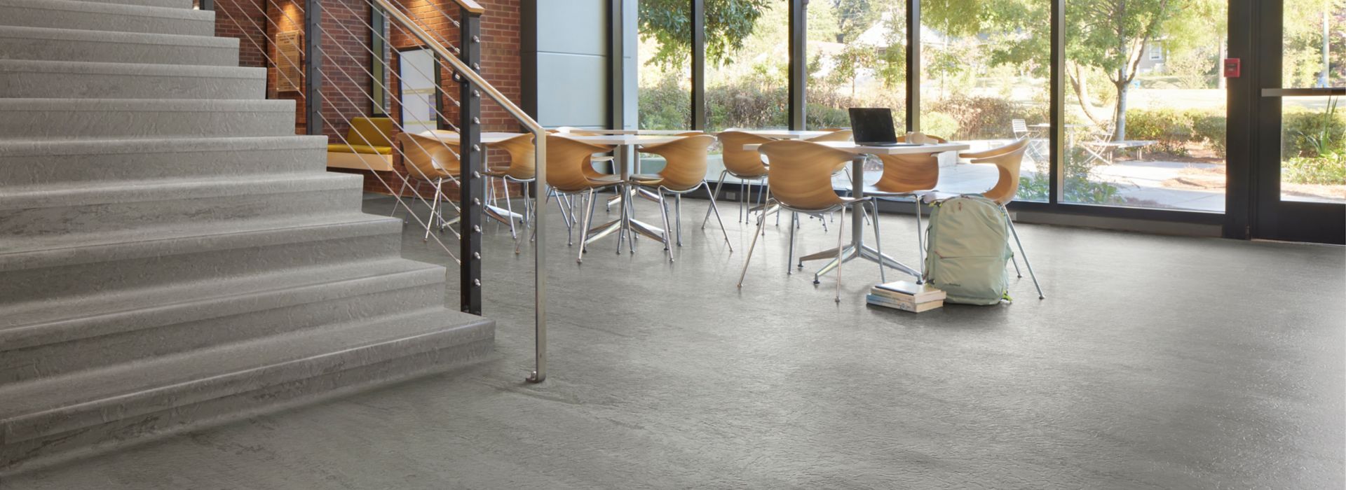 norament 926 arago Rubber Flooring in open space with tables and chairs