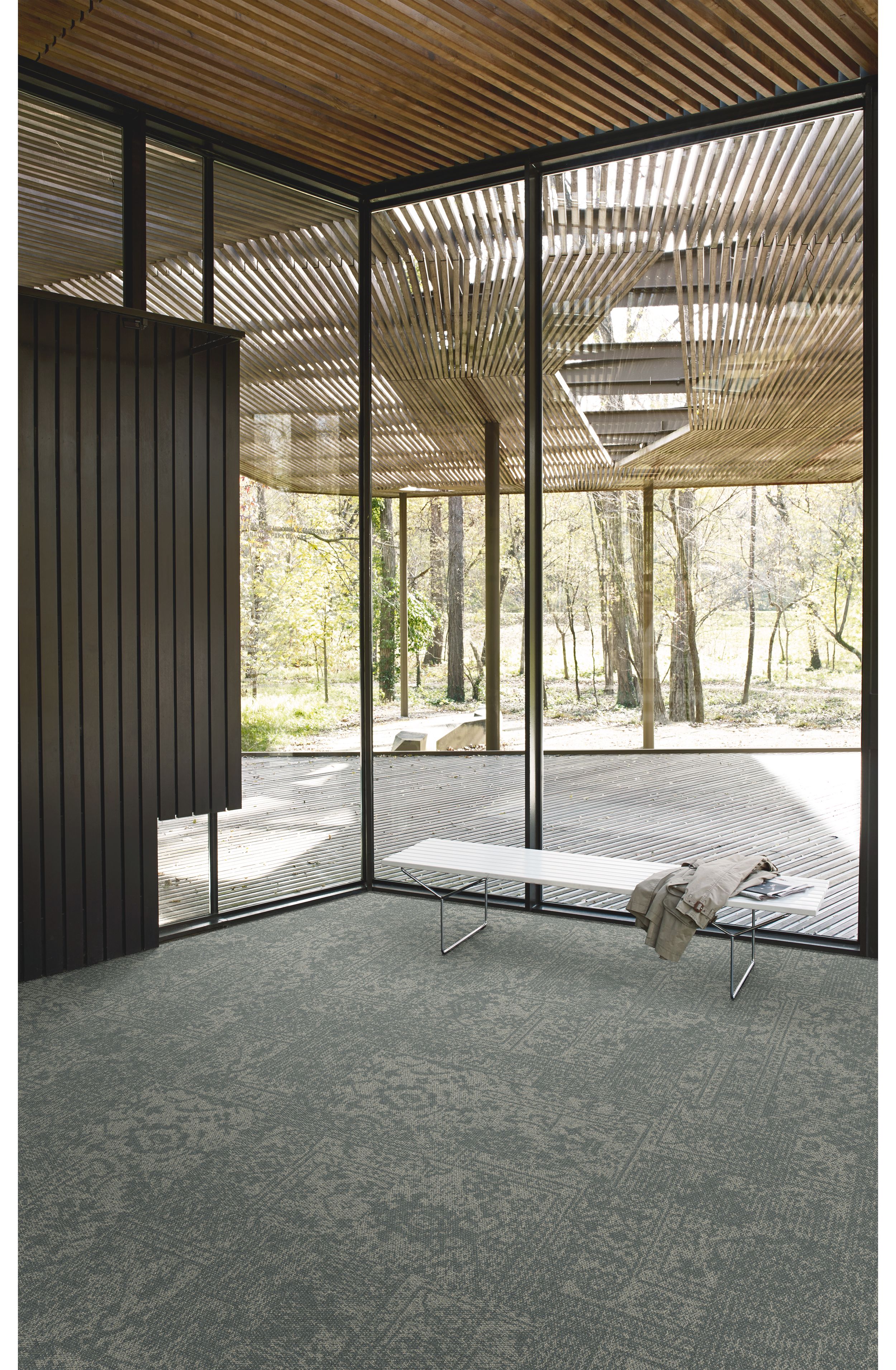 Interface Open Air 421 carpet tile in corner space with small white bench and wooden slat ceiling image number 3