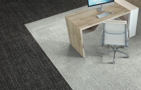 Interface Open Air 405 carpet tile in overhead view with small wooden workstation