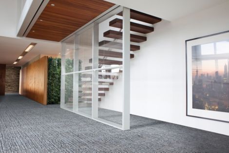 Interface UR201 carpet tile in office with living wall and open, wood staircase