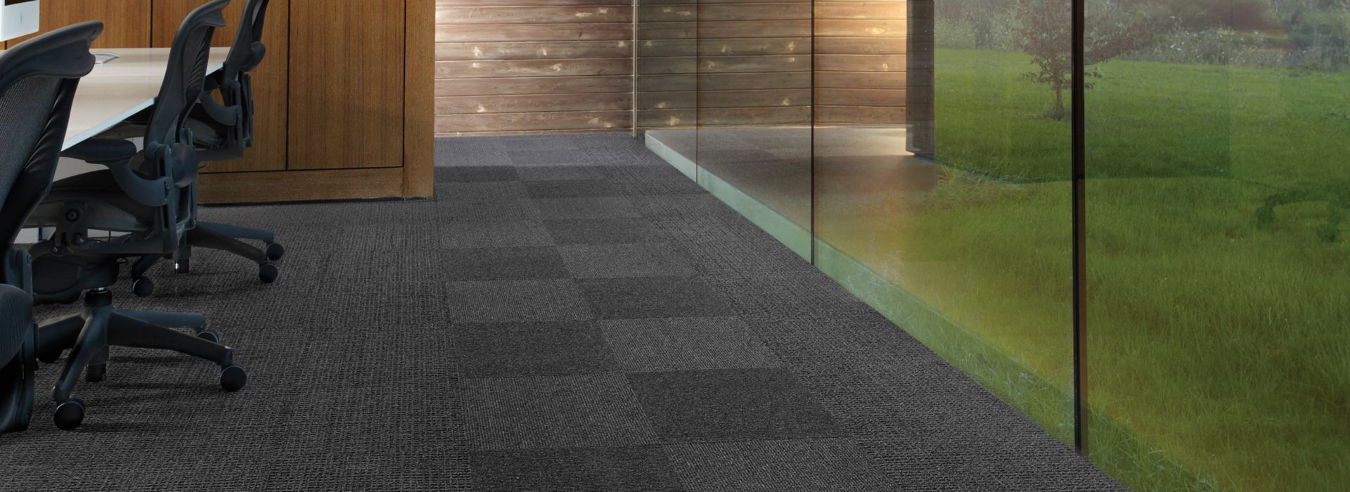 Interface UR202 and UR203 carpet tile in conference room with glass wall
