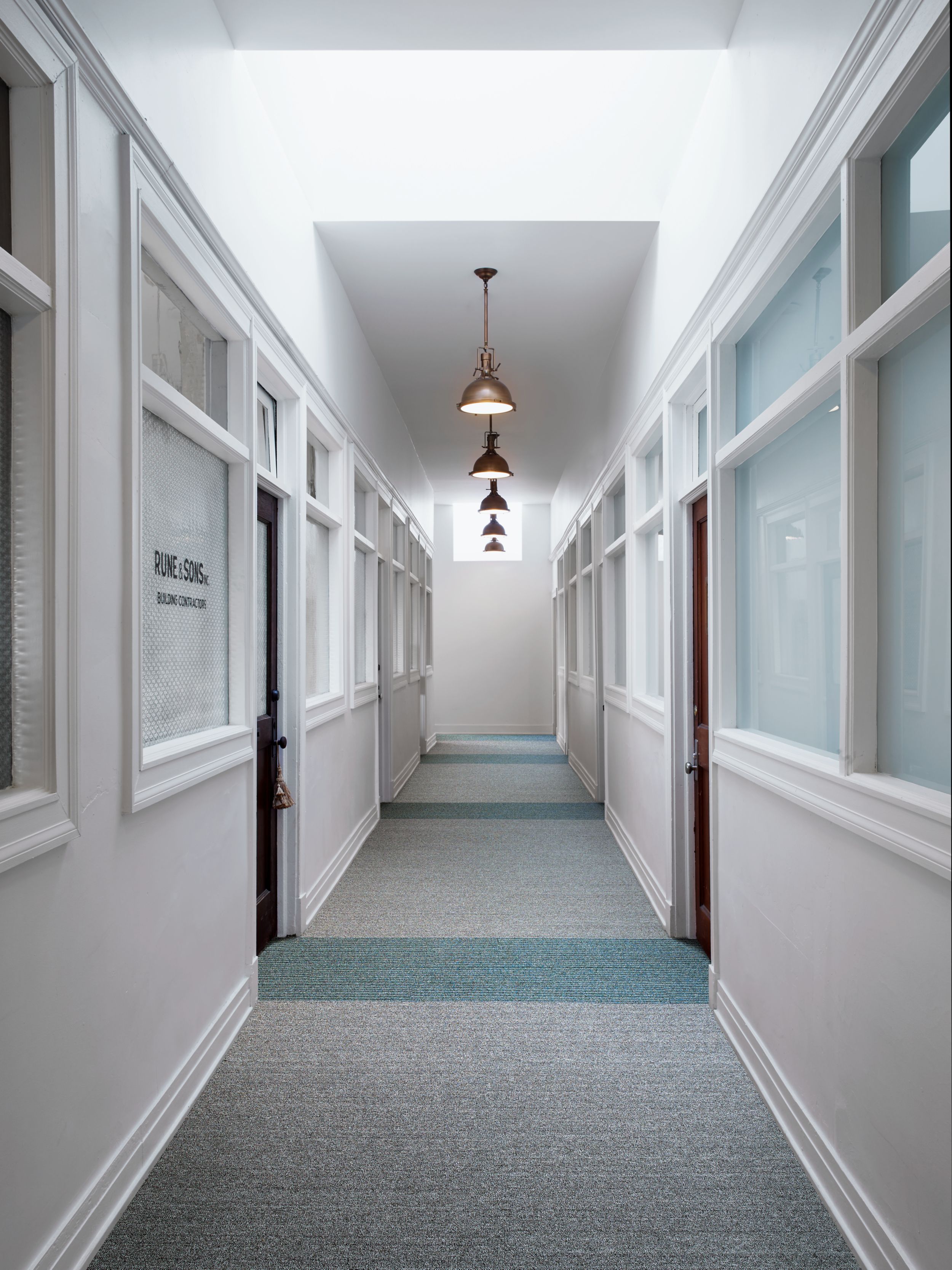 Interface WW860 and WW865 plank carpet tile in a building corridor image number 5