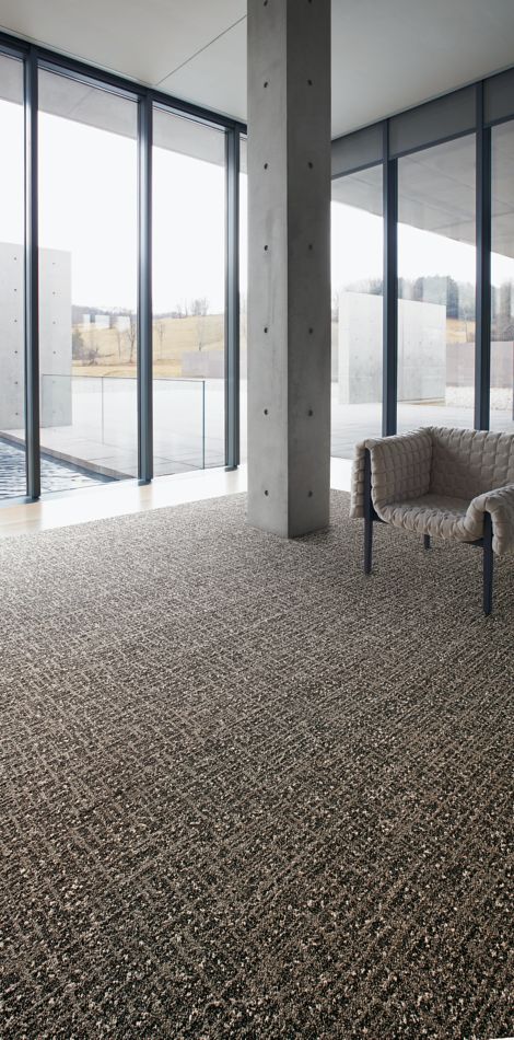 Interface WW890 plank carpet tile and Textured Stones LVT in lobby area with chair image number 3
