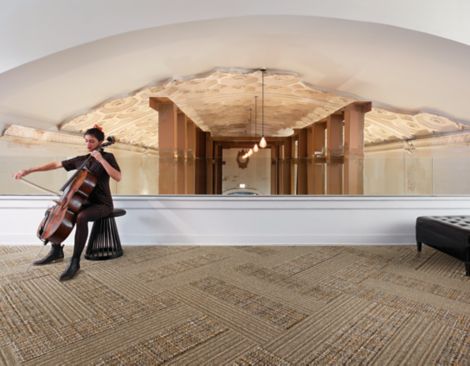 Interface WW865 and WW895 plank carpet tile in lofty space with musician image number 5
