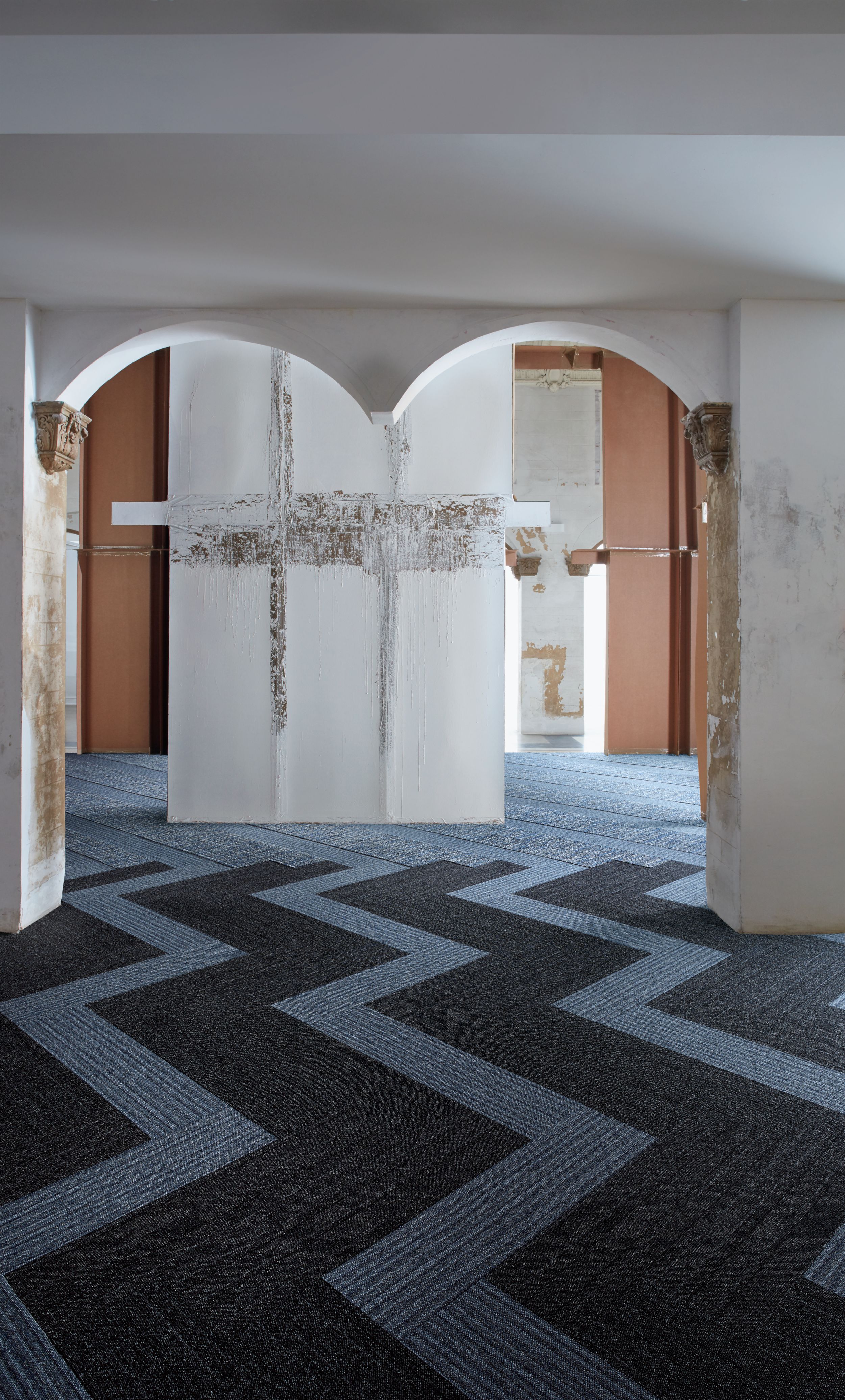 Interface WW865 and WW895 plank carpet tile in lobby setting with archway image number 4