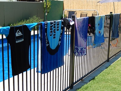 “Towels on Pool Fence” by Michael Coghlan is licensed under CC BY-SA 2.0