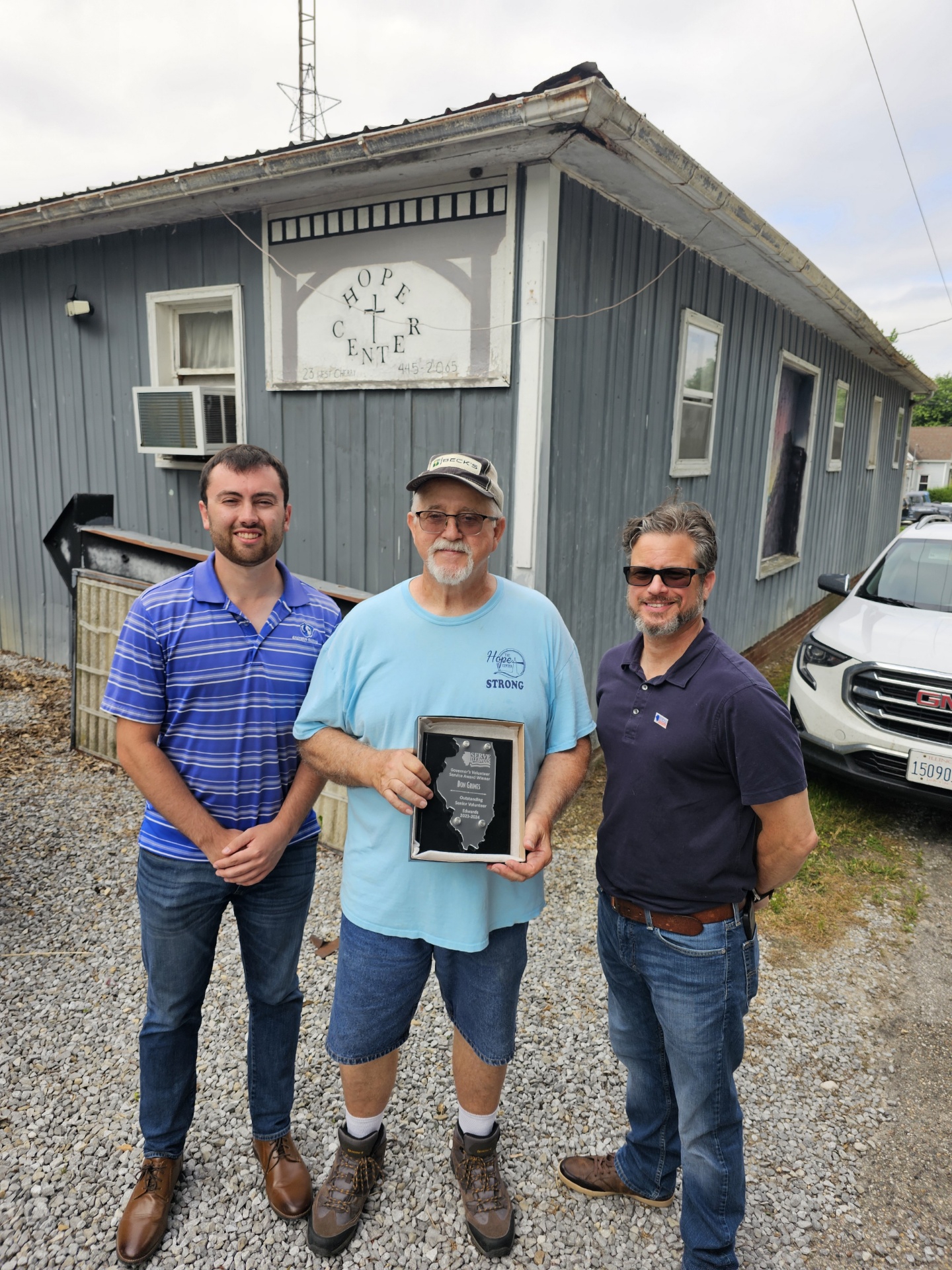 From left to right: Fisher Overstreet from Senator Terri Bryant/Representative Dave Severin’s office in Mount Vernon, Don Grimes holding his award, and Serve Illinois Volunteer Service Program Coordinator Anthony Wanless