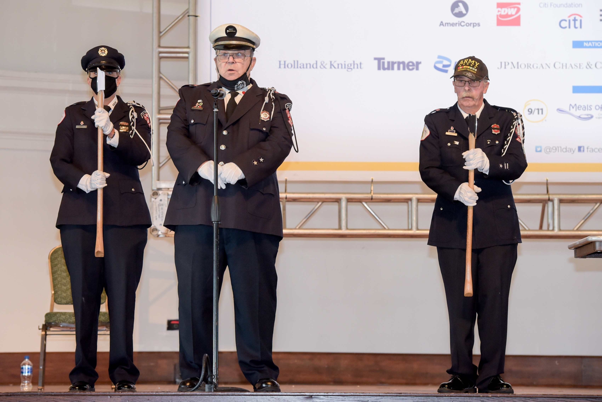 The Associated Fire Fighters of Illinois Honor Guard lead the moment of silence in remembrance of the 20th anniversary of 9/11 before the 2021 Meal Pack for 9/11 Day of Service event in the Aon Grand Ballroom at Navy Pier in Chicago, IL on Saturday, Sept. 11, 2021.  Photo by Mark Black