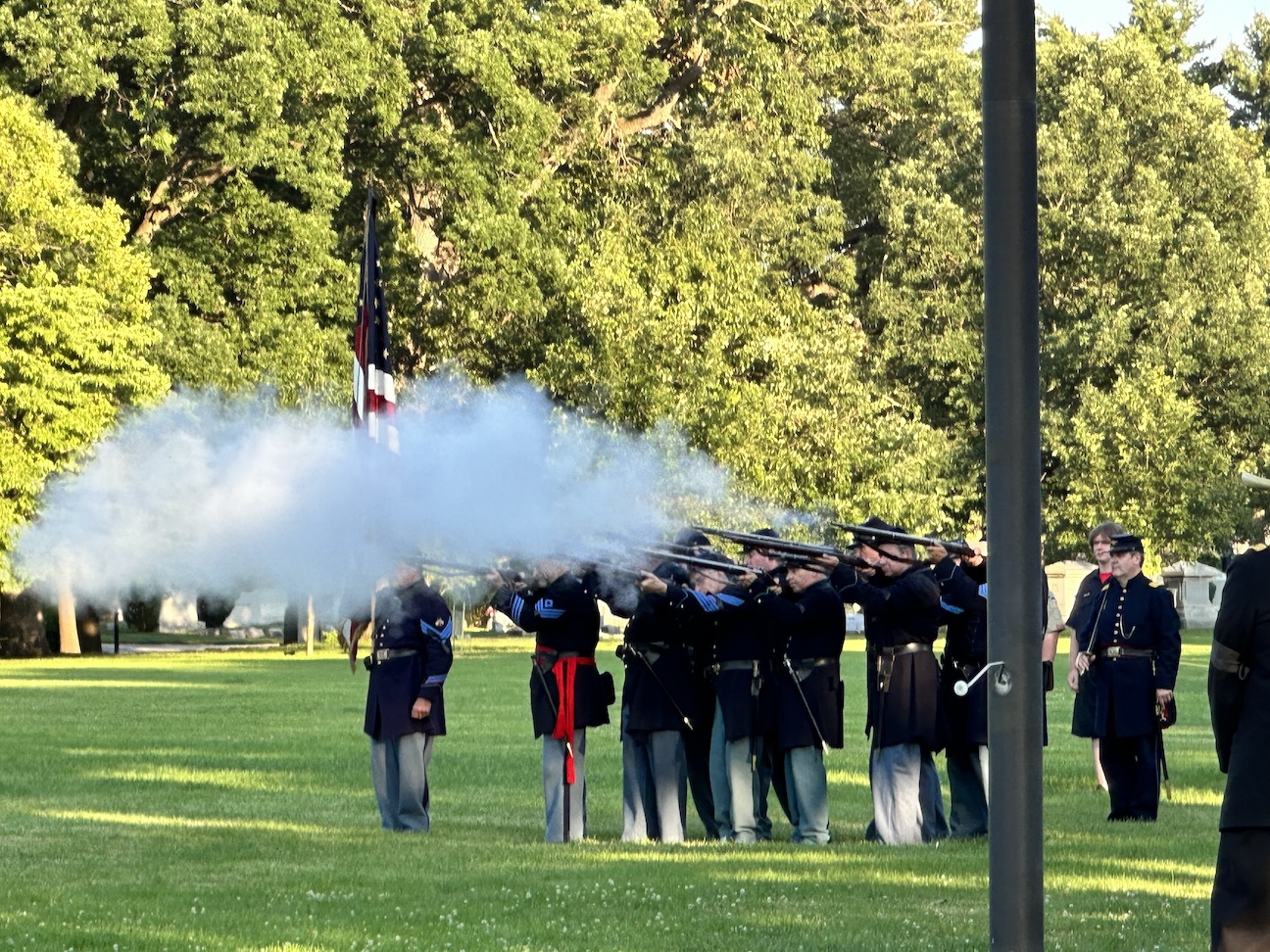 Civil War reenactors fire their rifles