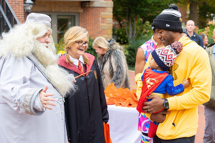 Illinois Governor and First Lady passing out candy to children in costume