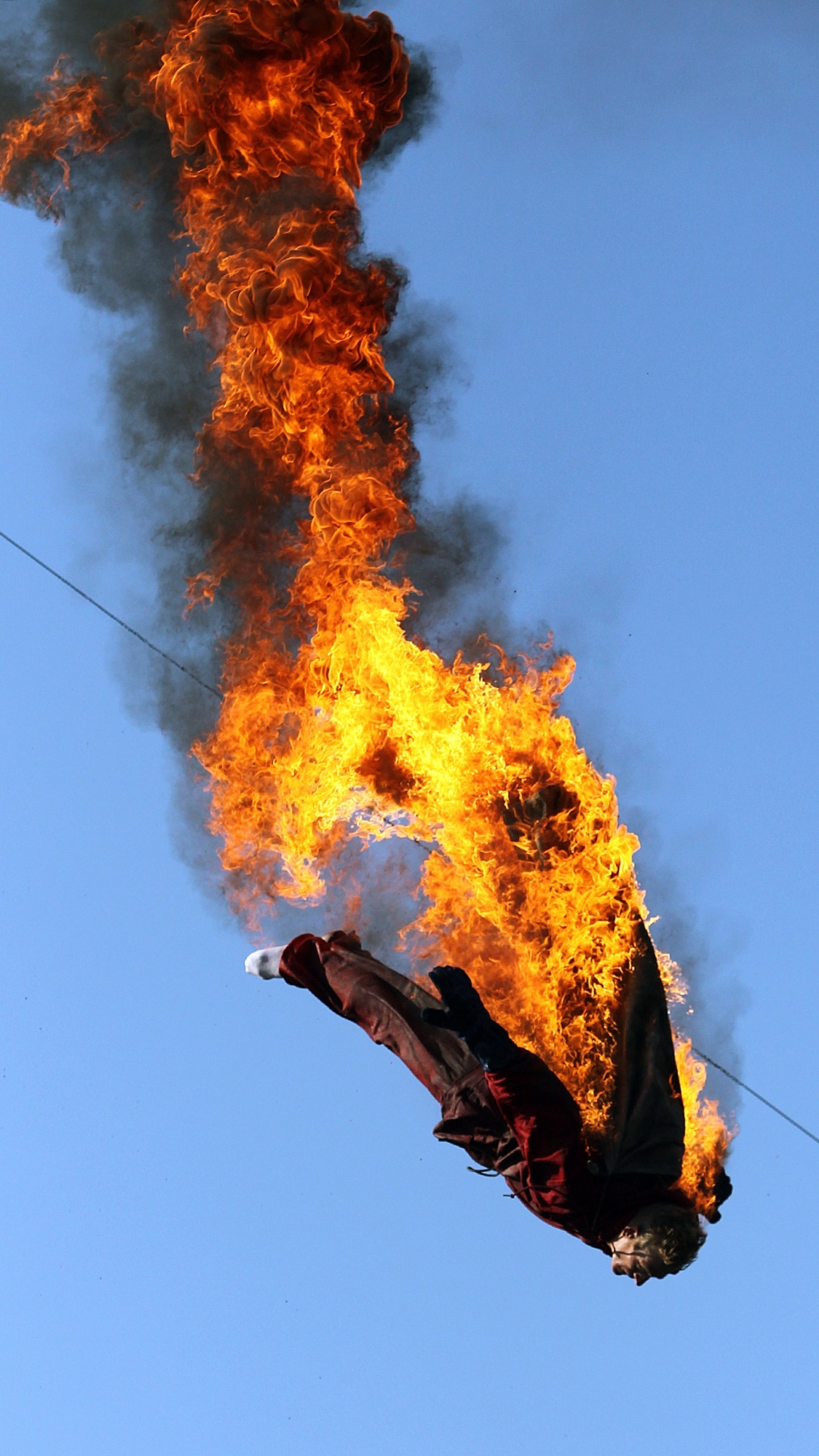 High diver Manuel Mendes, lights his body siut on fire to start the show Tuesday August 26, 2014 at the Great Allentown Fair.

//////