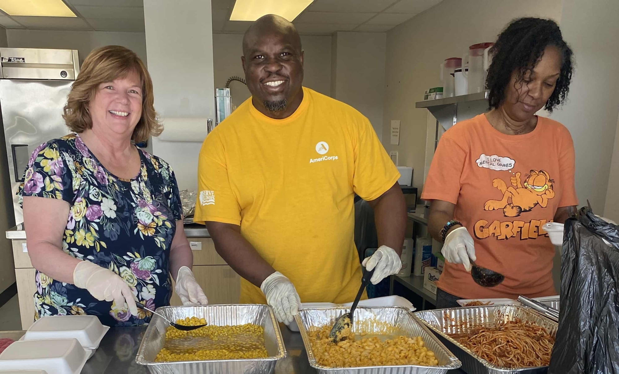 volunteers boxing meals