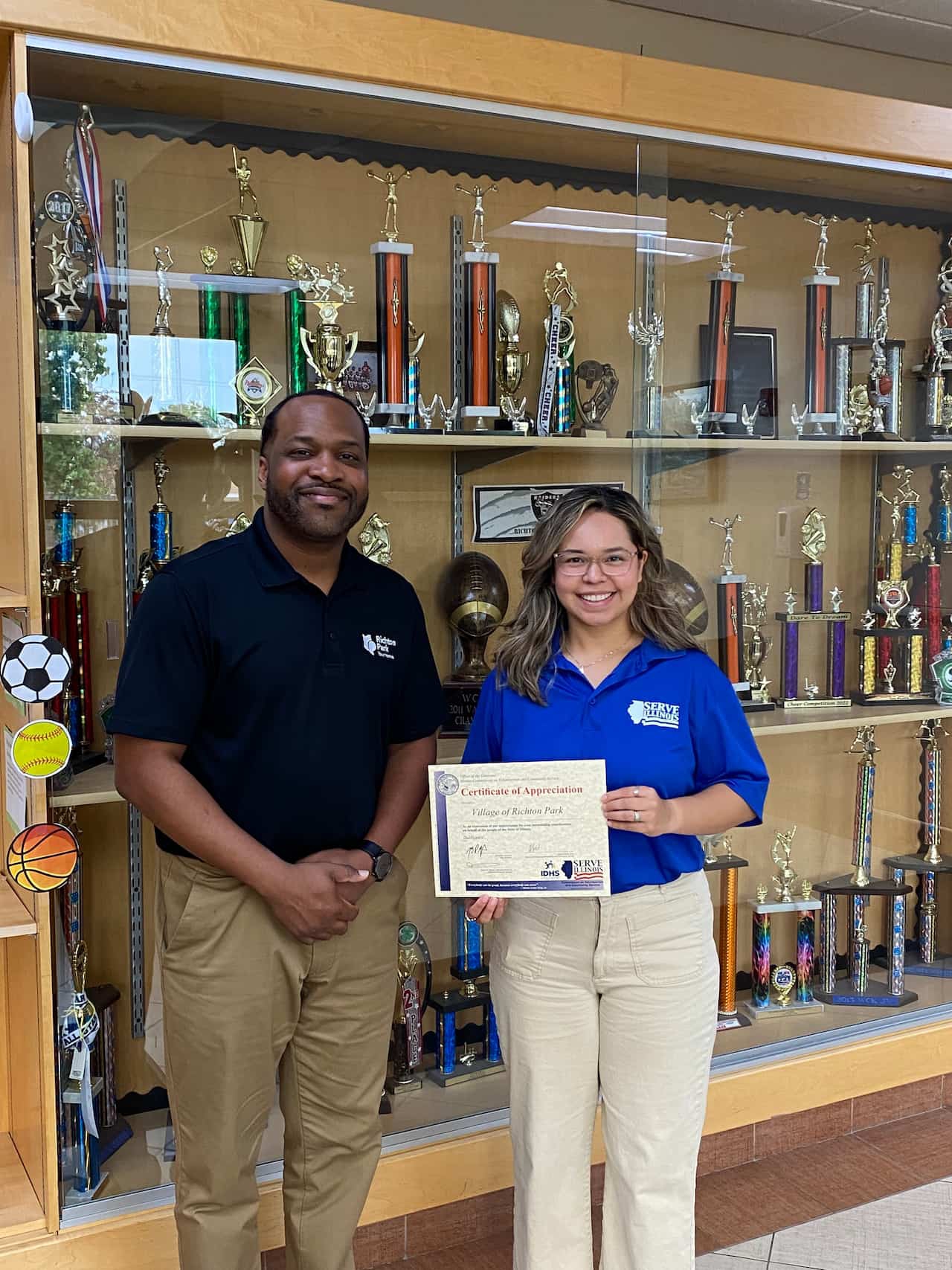 Serve Illinois Volunteer Service Program Coordinator Cecilia Maciel Martinez with Governor's Certificate recipient