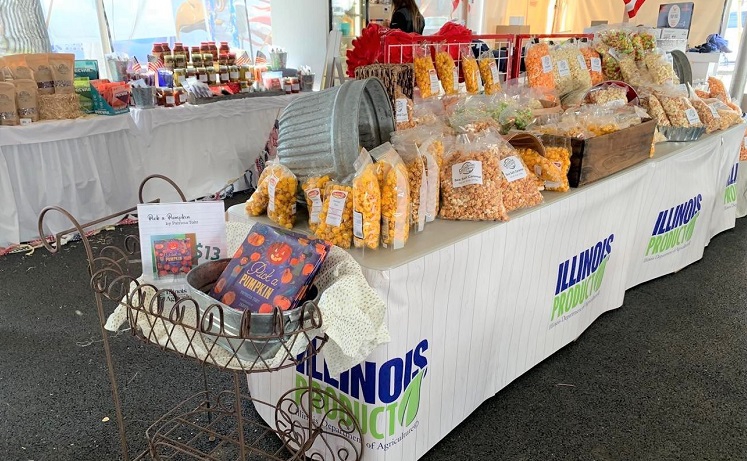 Picture of bags of flavored popcorn for sale at the Illinois Product store in the  Ag tent