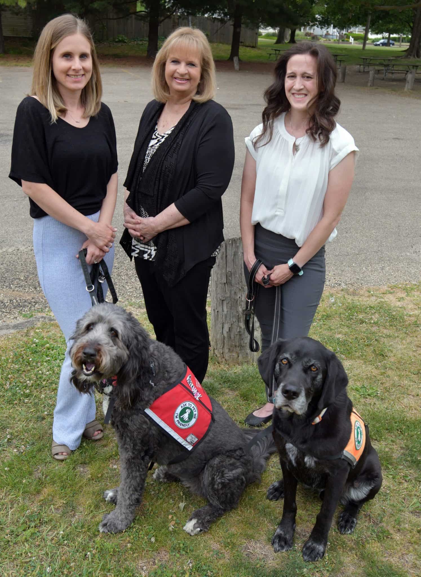 Michelle Yuen and Brandi Weyers with service dogs Picture