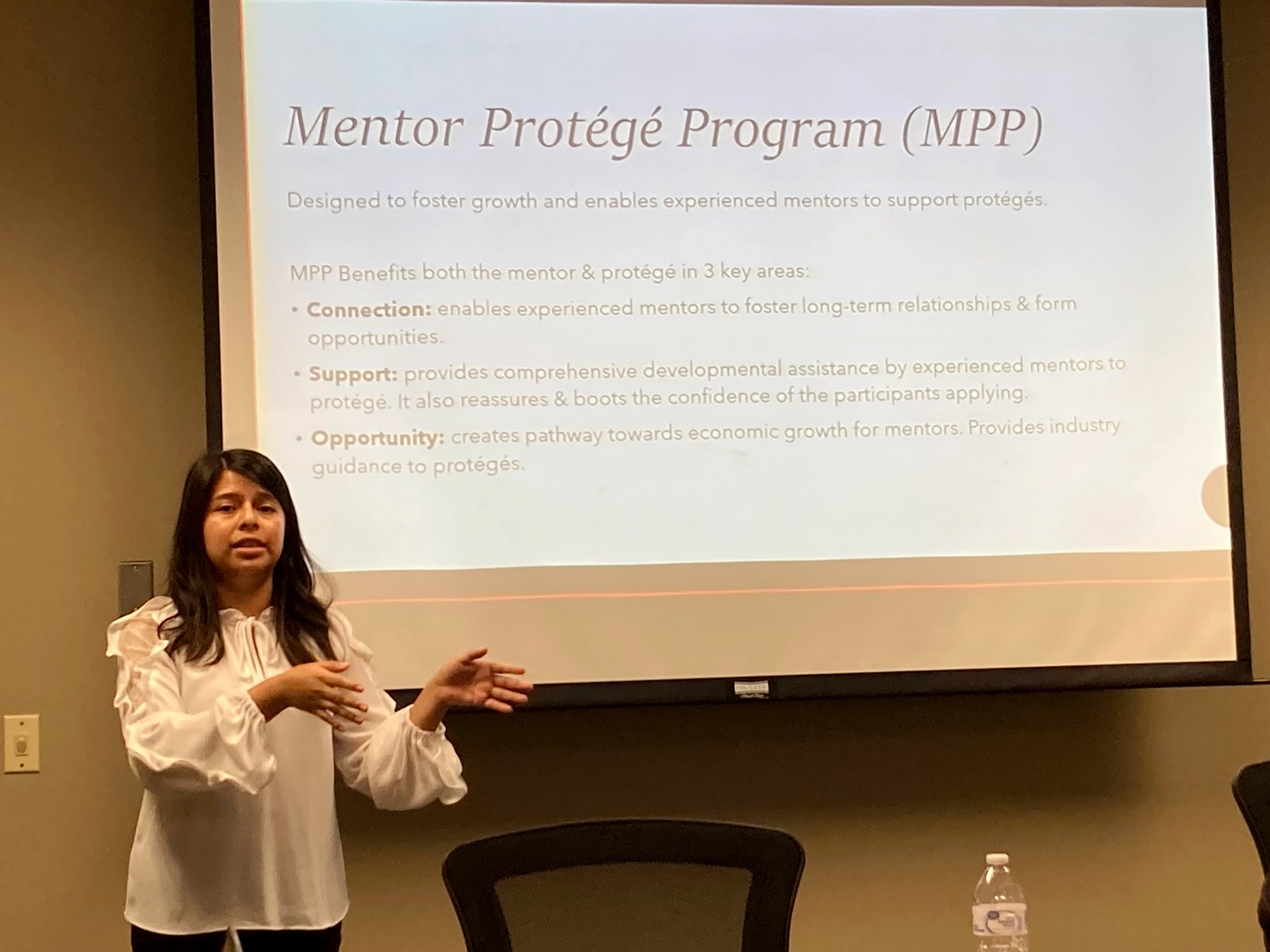 woman standing in front of slide talking